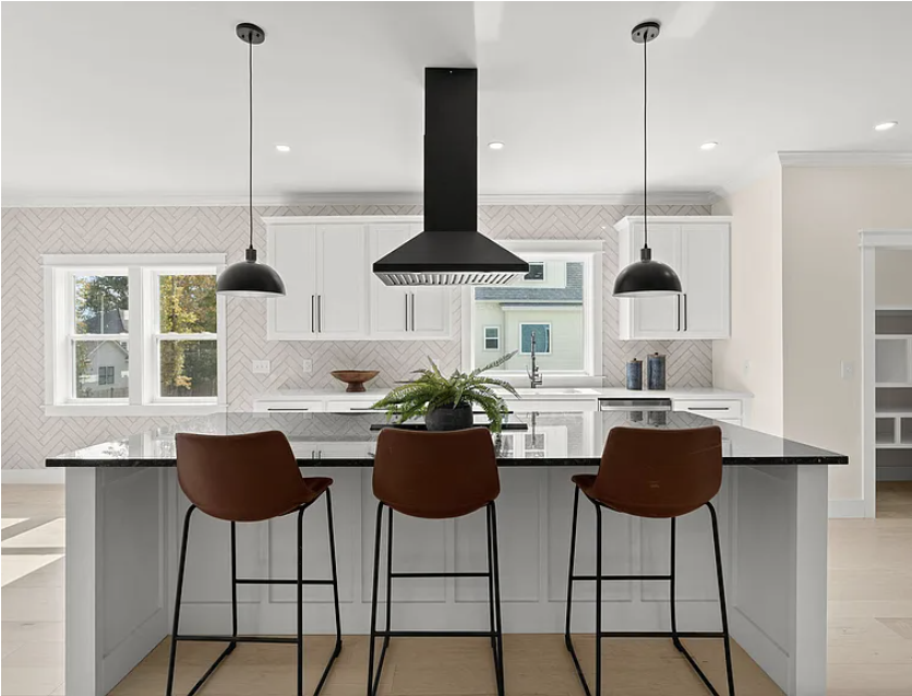 Kitchen herringbone backsplash and shaker cabinetry