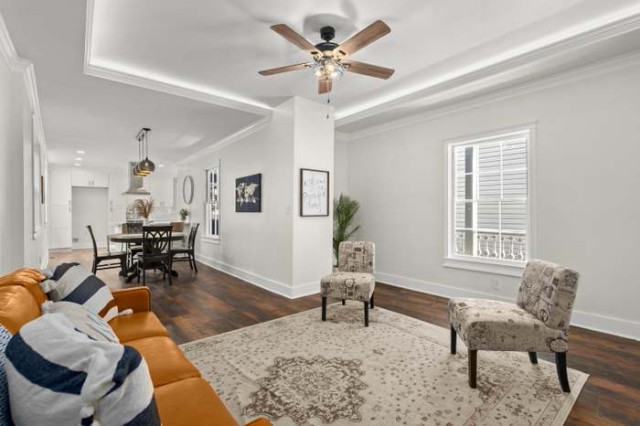 Open living and dining area with central pillar