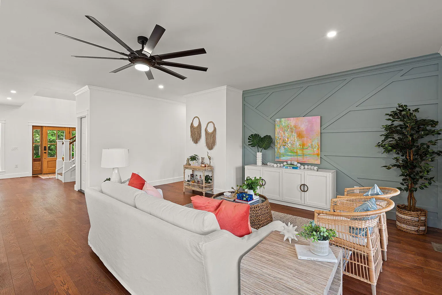 Living room seating facing the geometric board-and-batten accent wall