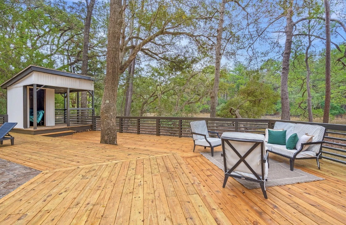 Wooden deck with seating area and tree cutout