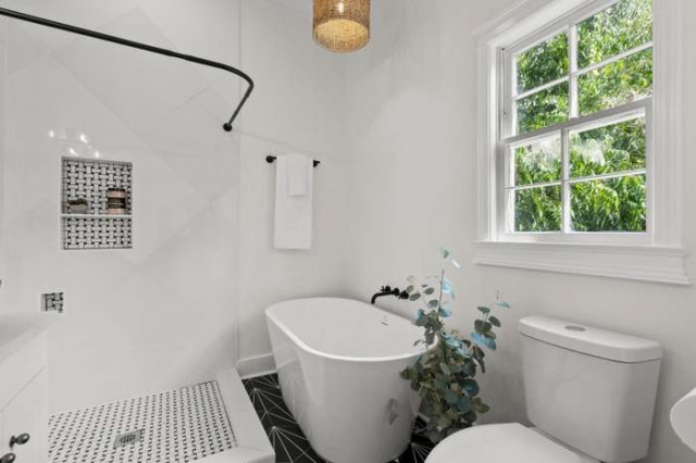 Primary bath with freestanding tub and geometric tile