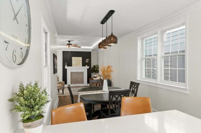 Dining table with perforated pendant lights