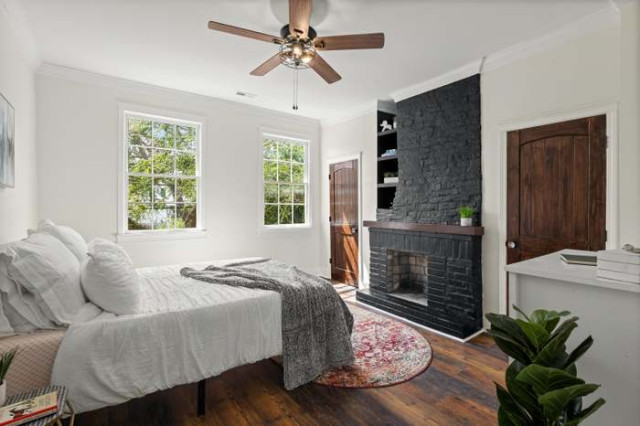 Primary bedroom seating area with terracotta rug