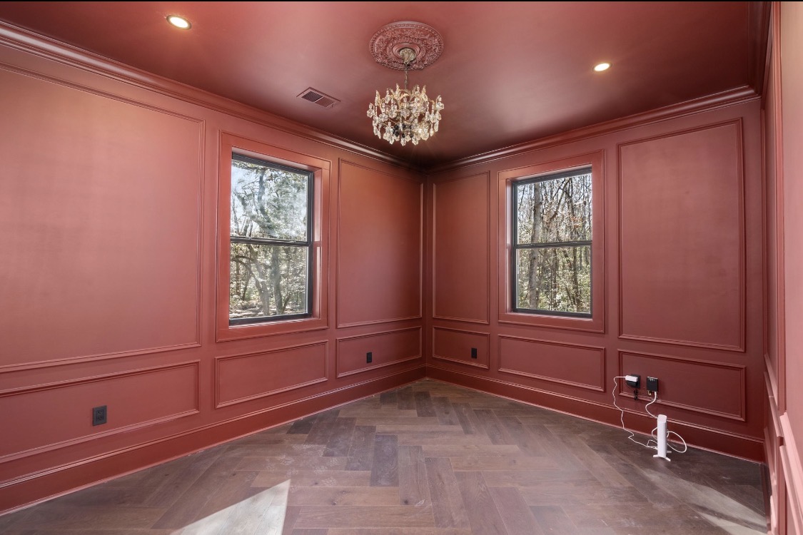 Terra-cotta millwork study with herringbone floors