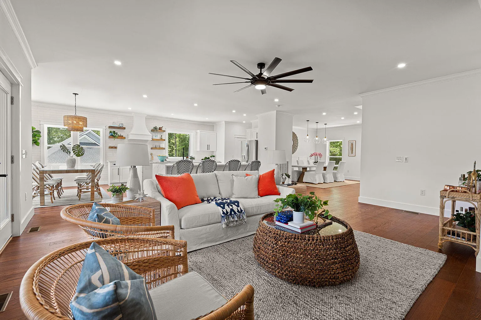 Open living area with rattan seating overlooking the kitchen