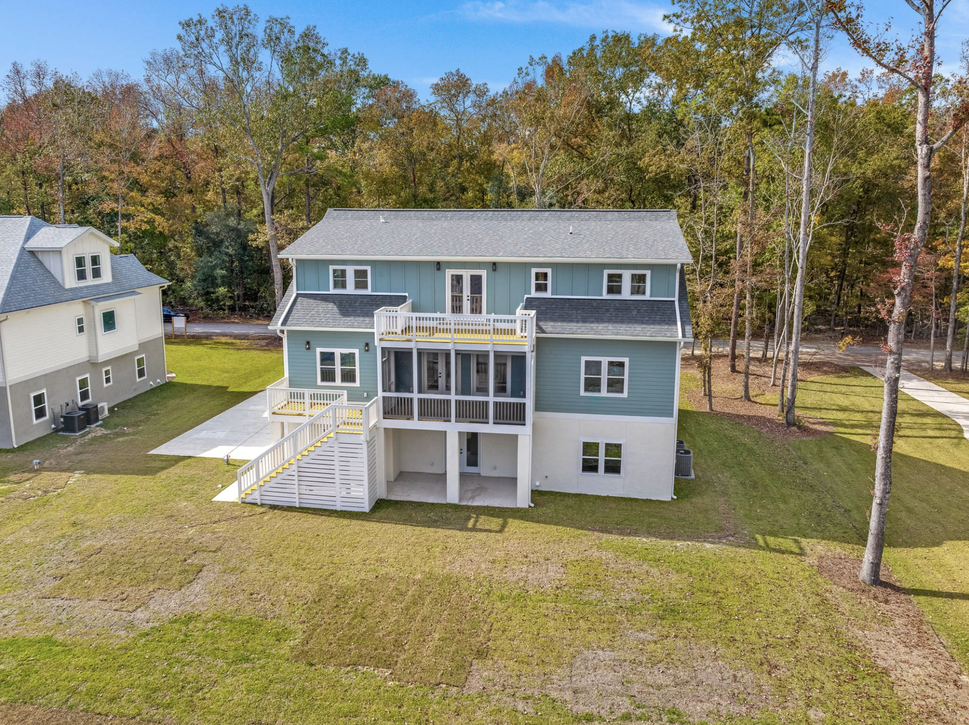Rear elevation with multi-level deck and screened porch