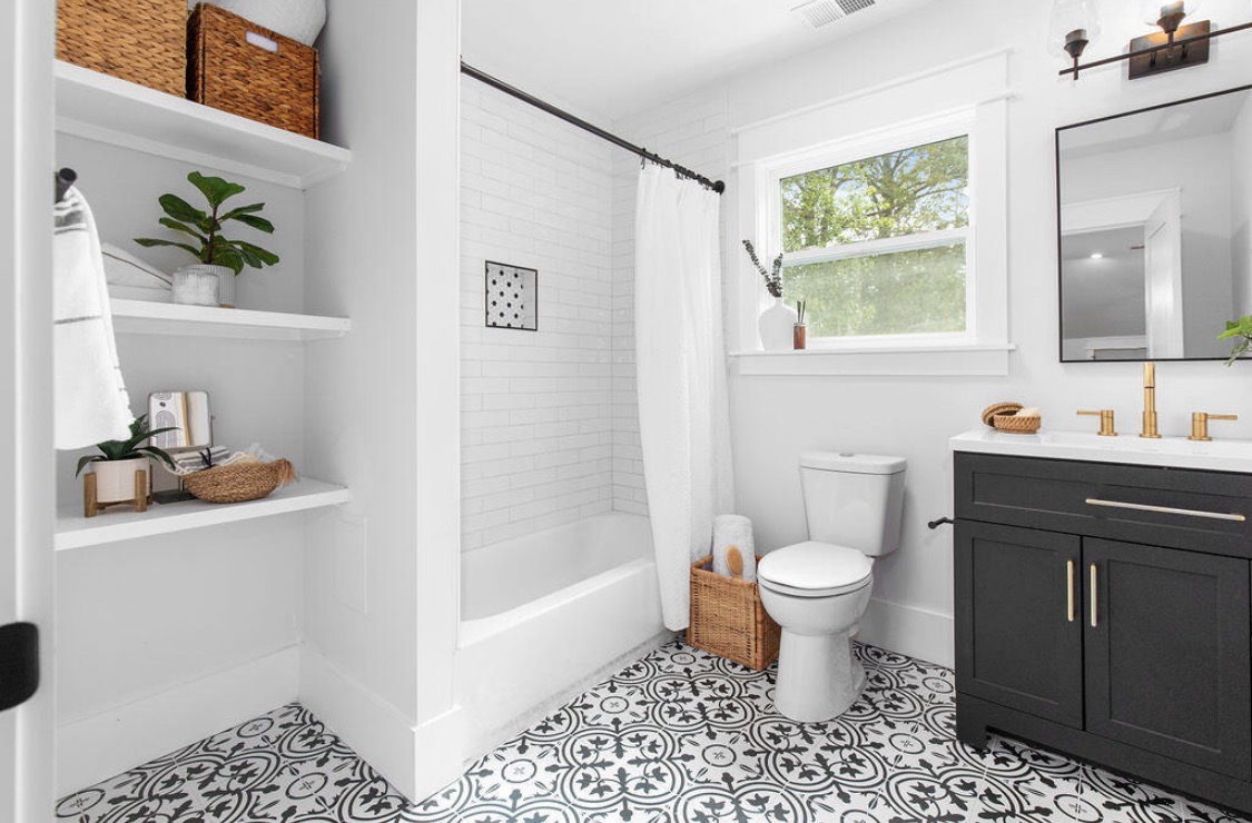 Bathroom with patterned encaustic floor and charcoal vanity