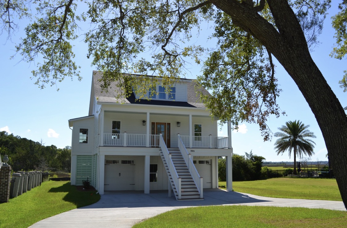 Eye-level view of the elevated home on white pilings