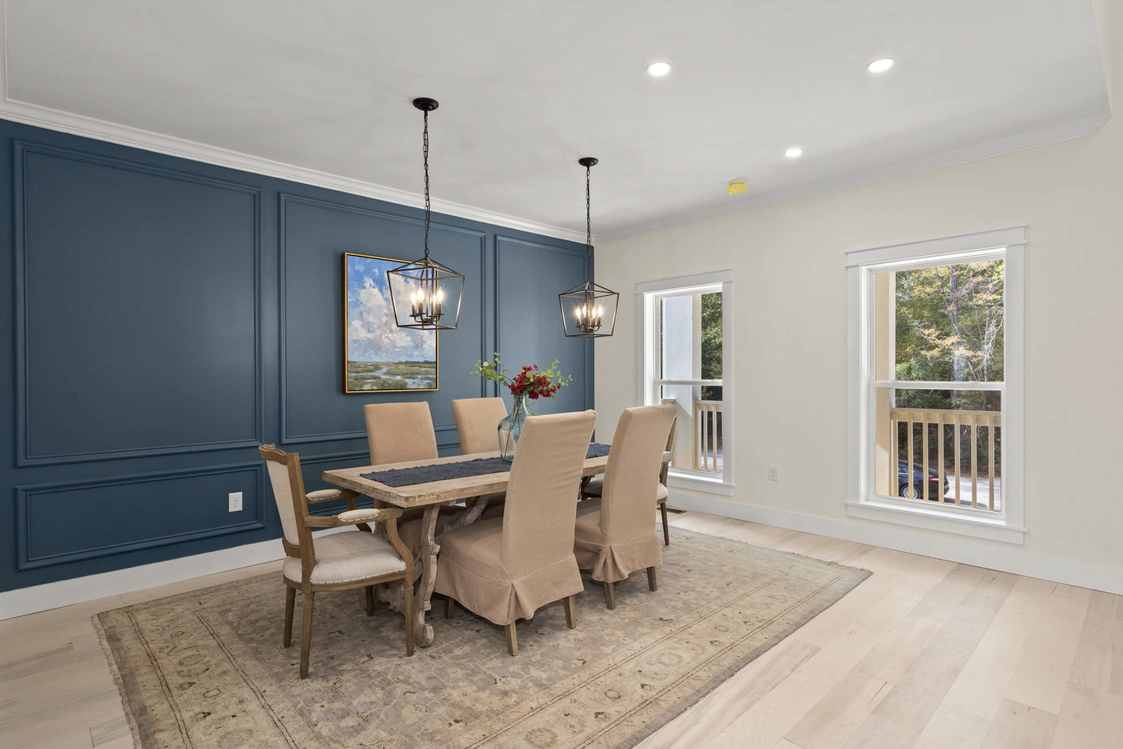 Dining room with deep blue paneled accent wall
