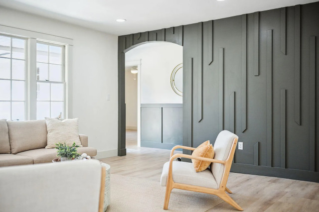 Living area with charcoal slat feature wall and arched doorway