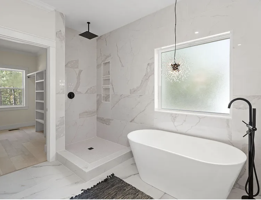 Primary bath walk-in shower with freestanding tub and closet