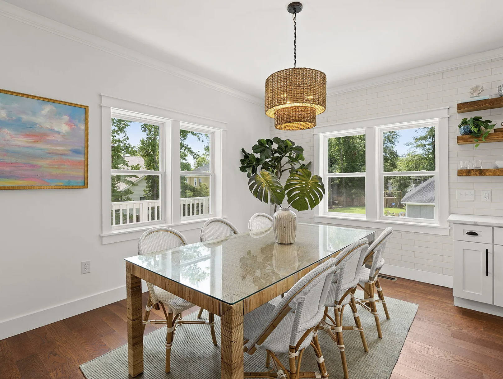 Breakfast nook with rattan dining table and tiered pendant