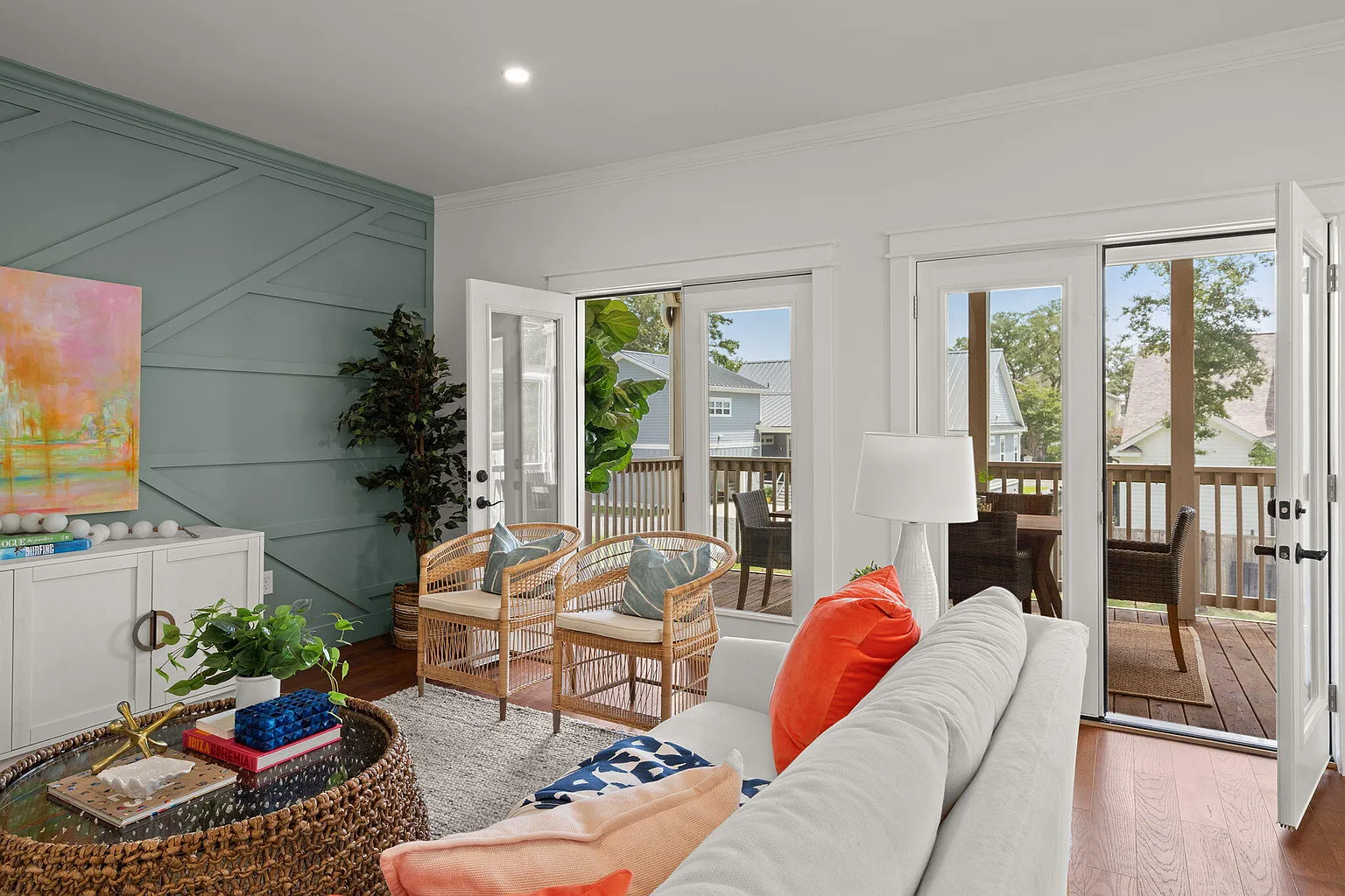 Living room detail with French doors open to the porch