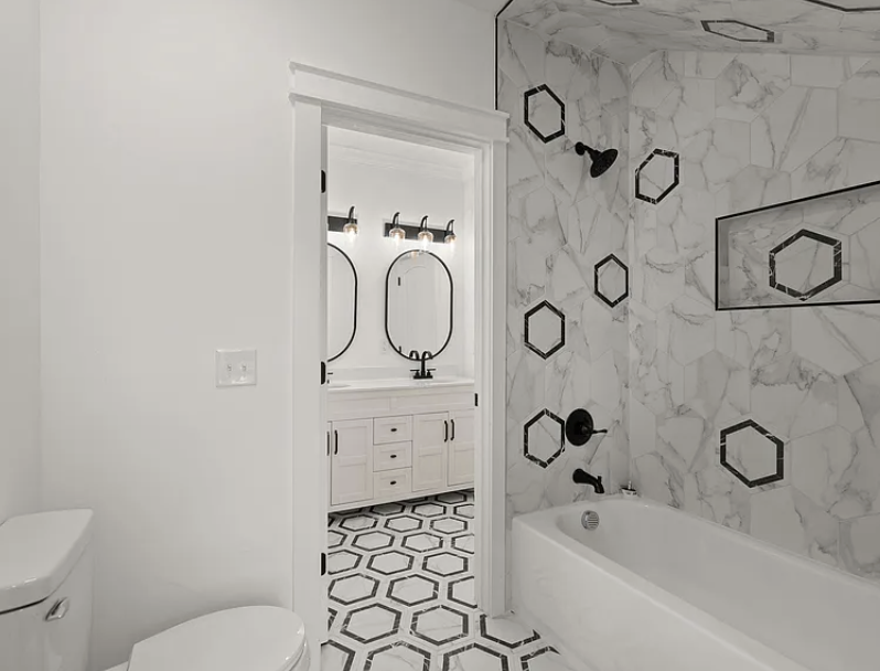 Hall bathroom with tiled tub-shower combination