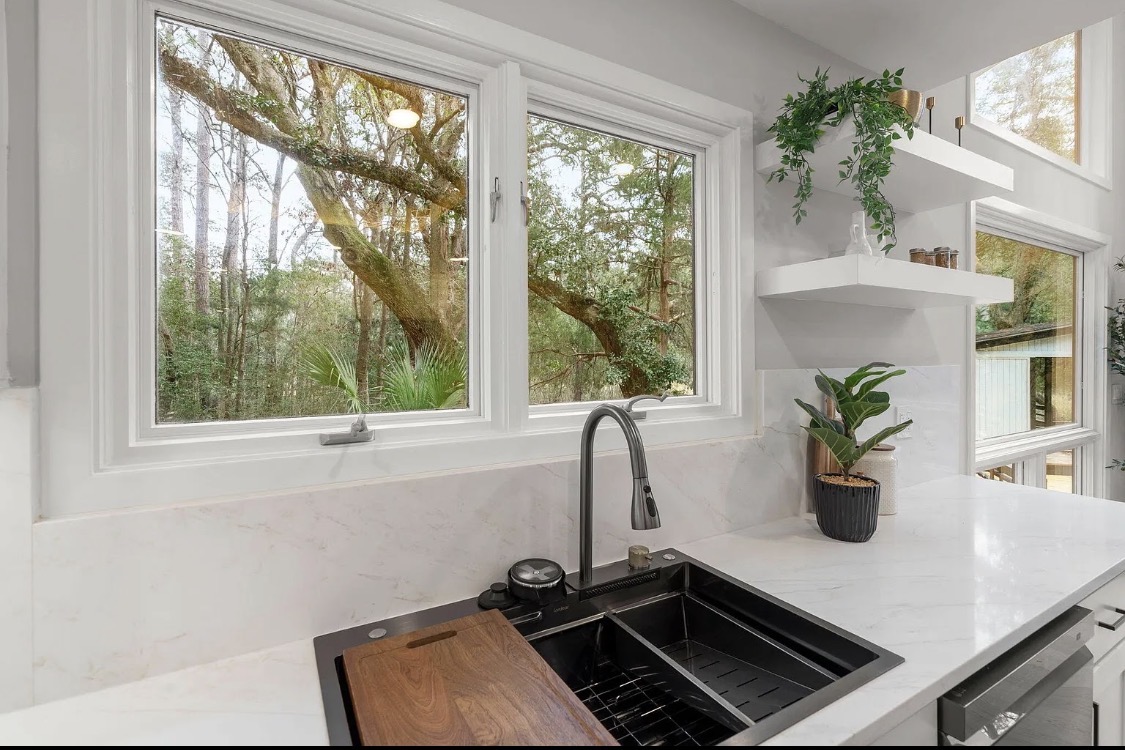 Kitchen sink workstation with matte-black fixtures