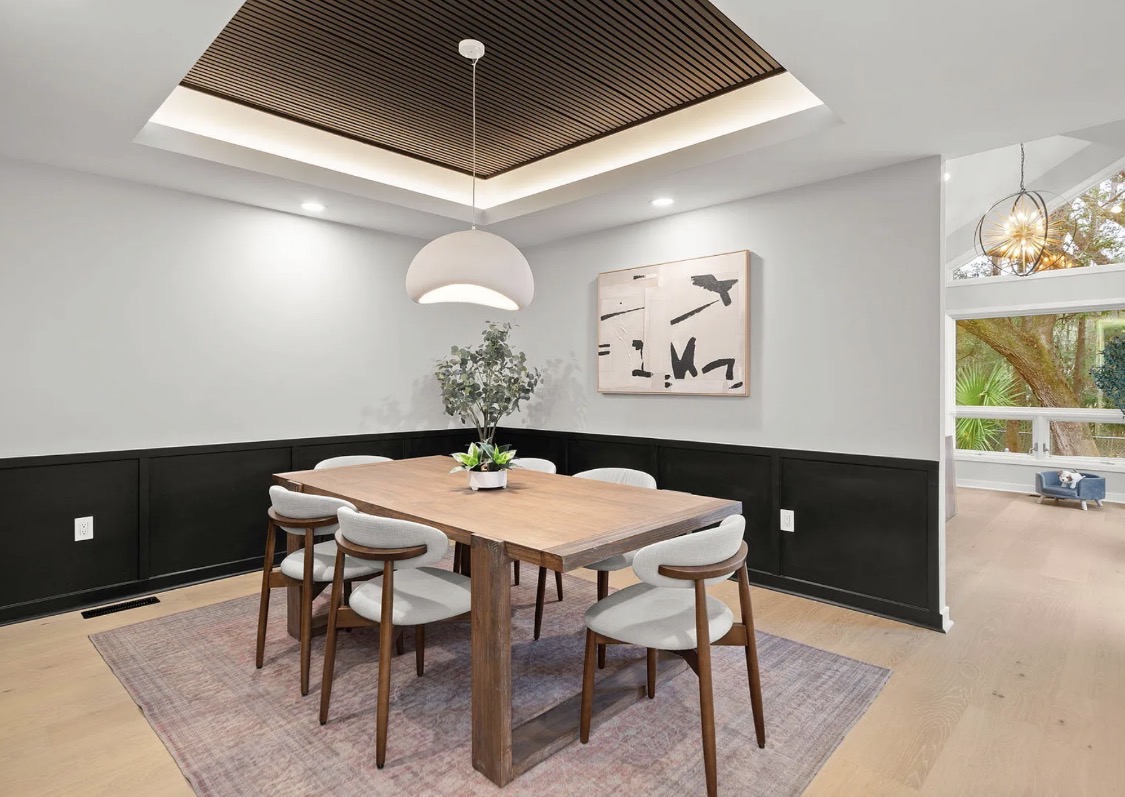 Formal dining room with black wainscoting