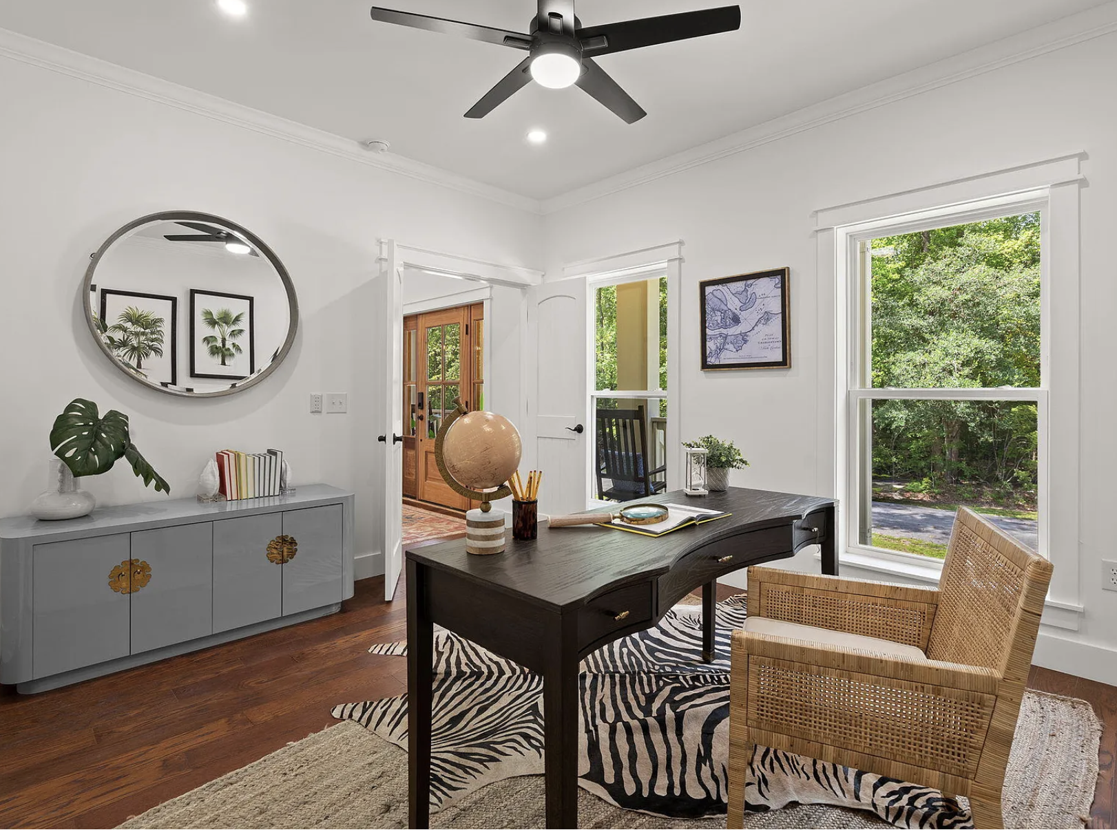 Home office with curved desk and zebra hide rug