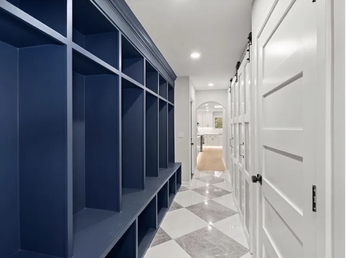Hallway with navy built-in cubby storage