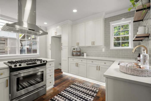 L-shaped kitchen with gas range and open wood shelving