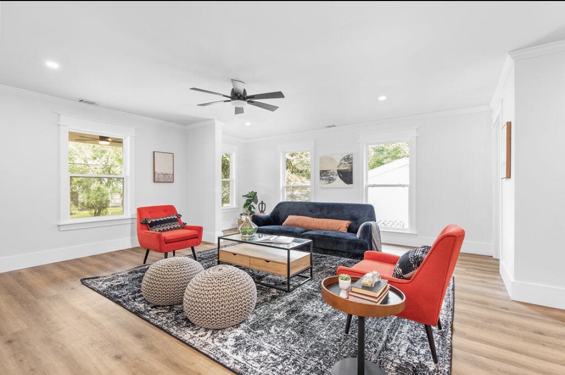 Living room with staircase to second floor