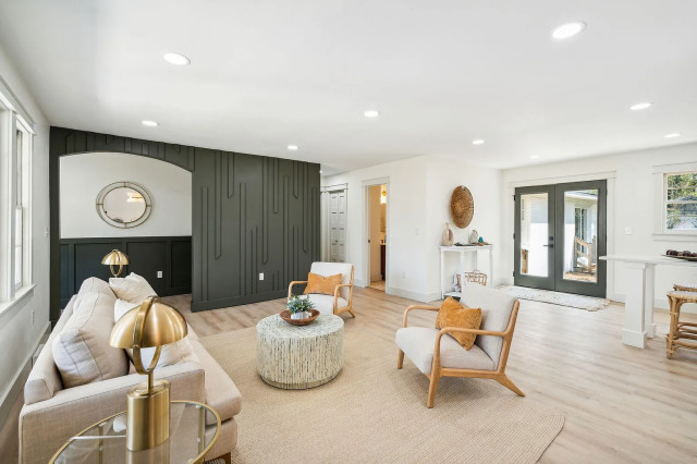 Living room looking toward glass entry doors
