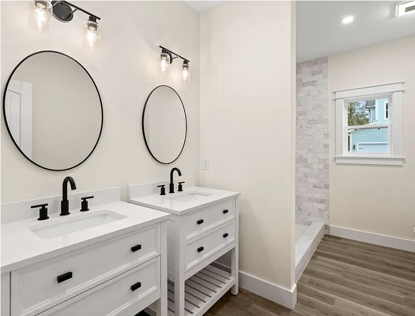 Dual vanity bath with marble subway tile shower