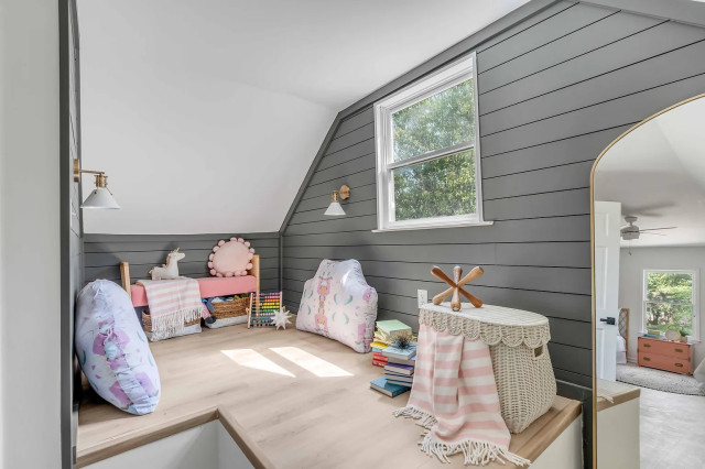 Kids reading nook with gray shiplap and gold sconces