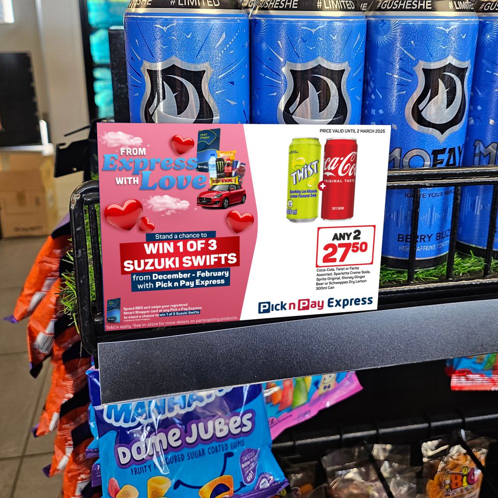 Pick n Pay Express From Express With Love Valentine's shelf-talker featuring a red Suzuki Swift, Smart Shopper card and a two-for product offer on a pink gradient background with hearts.