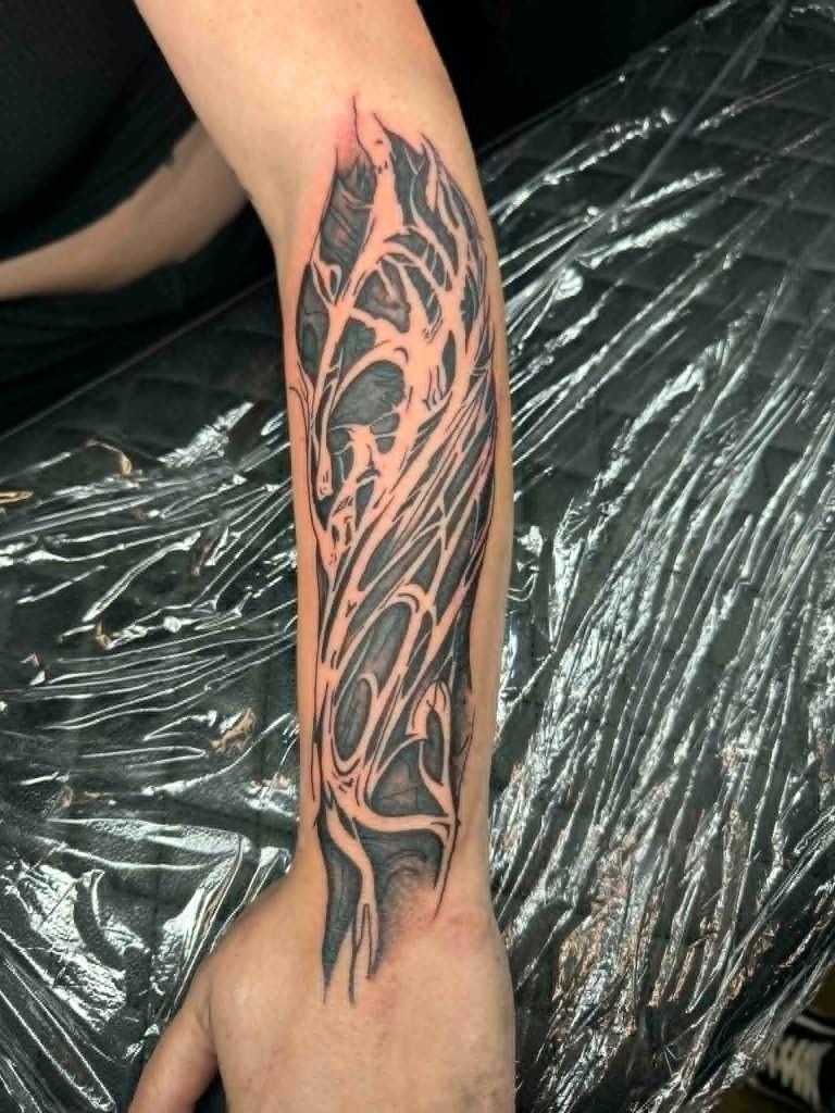 Biomechanical forearm tattoo