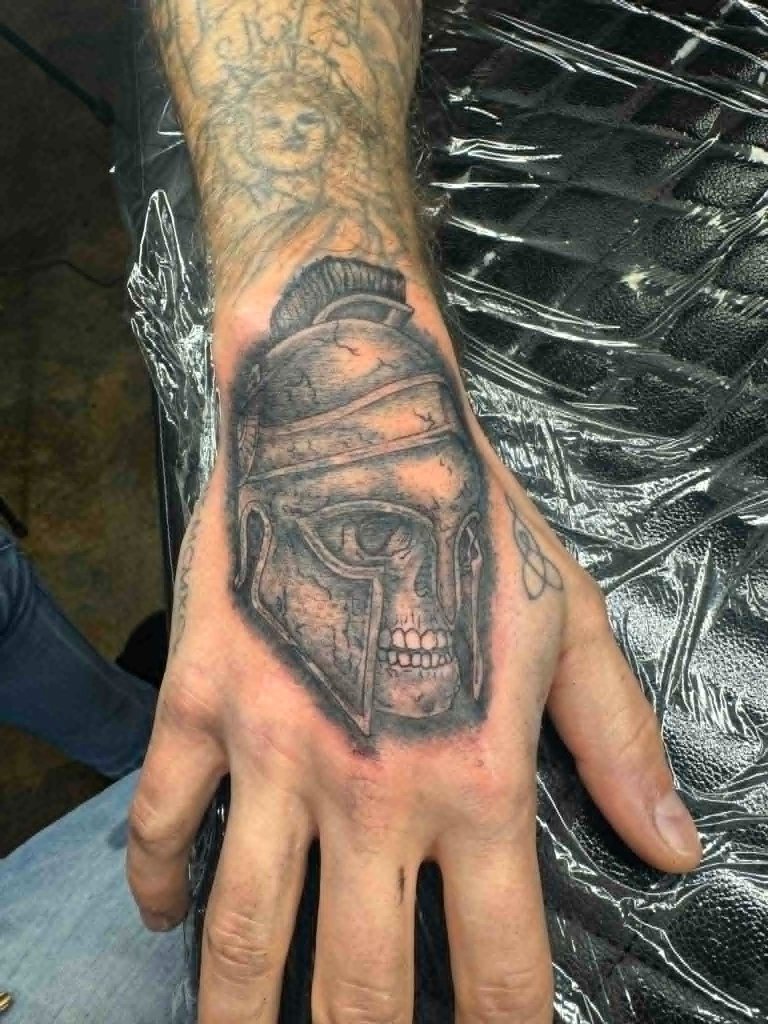 Spartan helmet hand tattoo