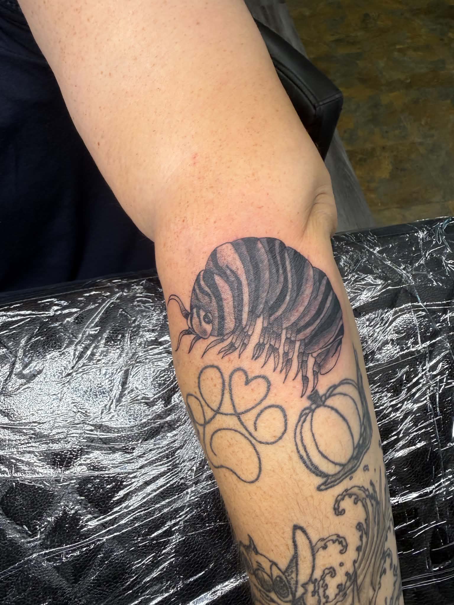 Pill bug isopod forearm tattoo