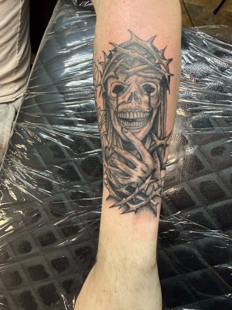 Skull with crown of thorns