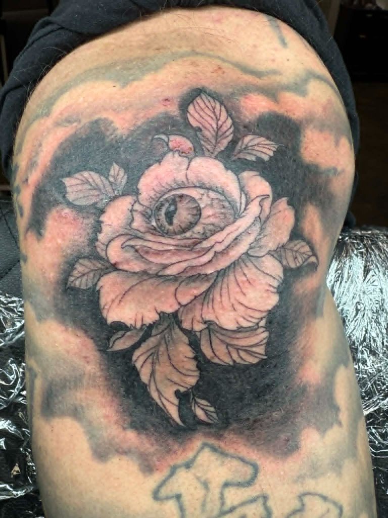 Rose with eye tattoo
