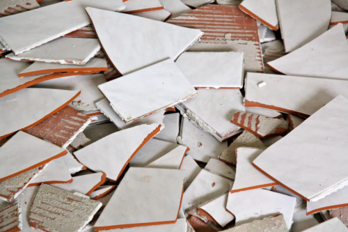 Removed tile pieces - PTAH Flooring tile removal project