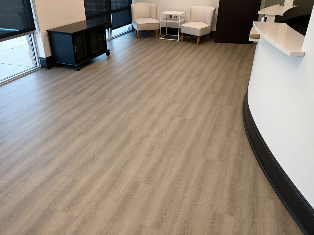 Premium luxury vinyl plank flooring installation in a commercial lobby