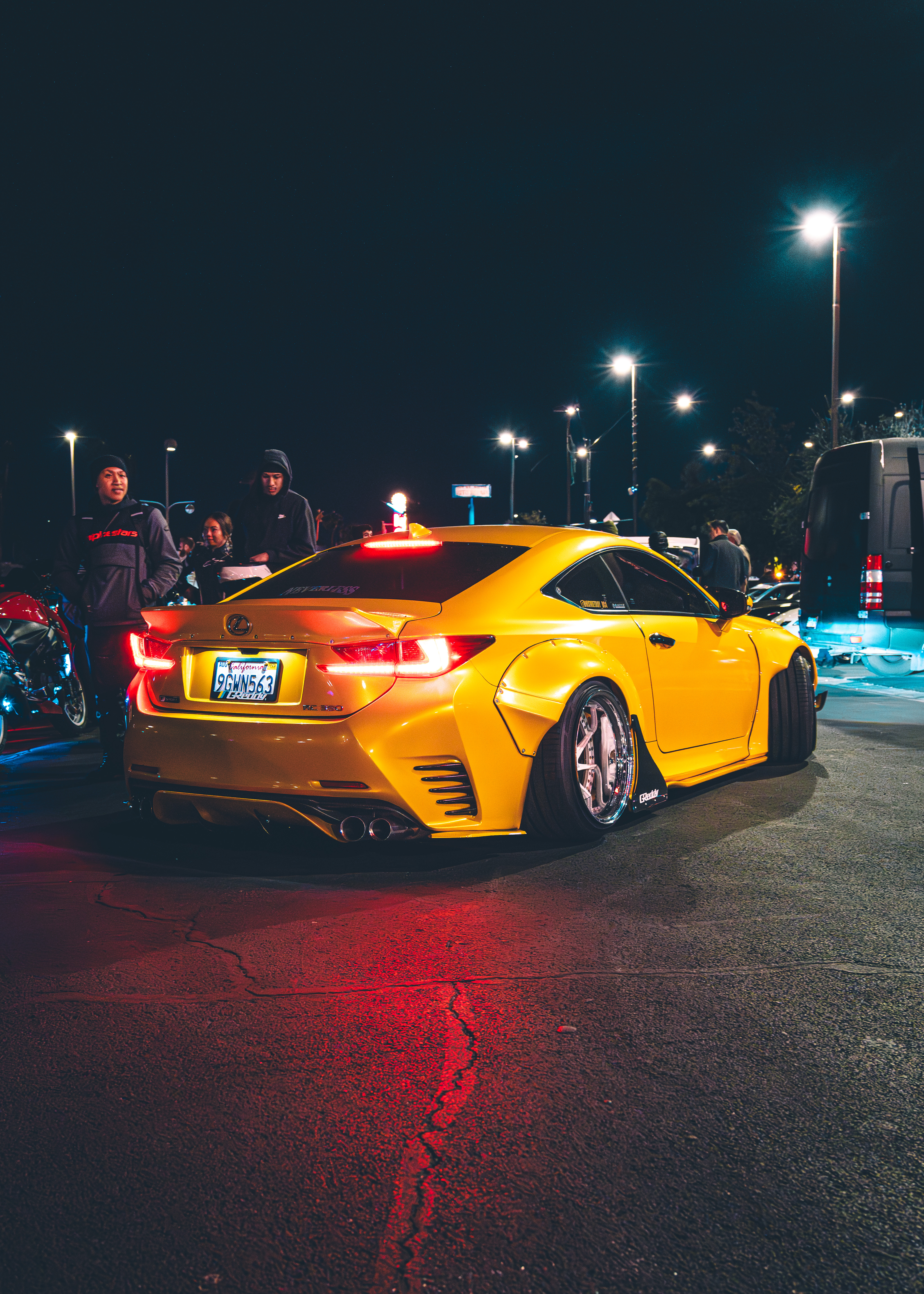Las Vegas Night Car Meet - photography automotive photography by Chan2blazed Media: A wide-body yellow Lexus RC 350 lit by street lamps at a Las Vegas night car meet — deep blacks, chrome deep-dish wheels, and red taillight glow on the asphalt.