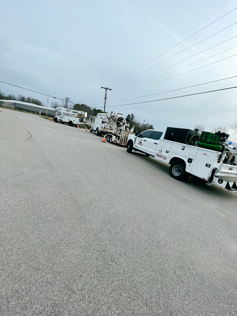 Mobile fleet oil change — CRANETEC contractor fleet vehicles staged at yard for on-site oil service