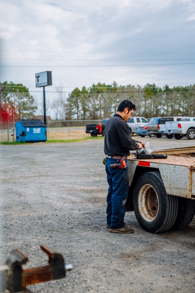 Utility equipment service technician performing bucket truck inspection Orlando