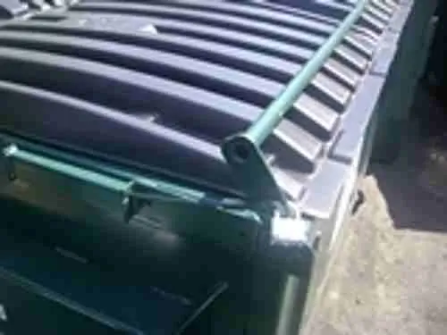 Locking dumpster bar installed on commercial dumpster in Maryland