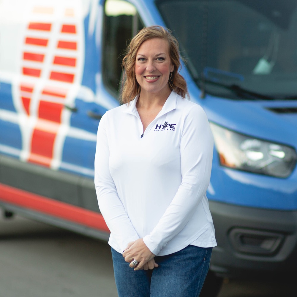 A HYPE team member beside a branded service van