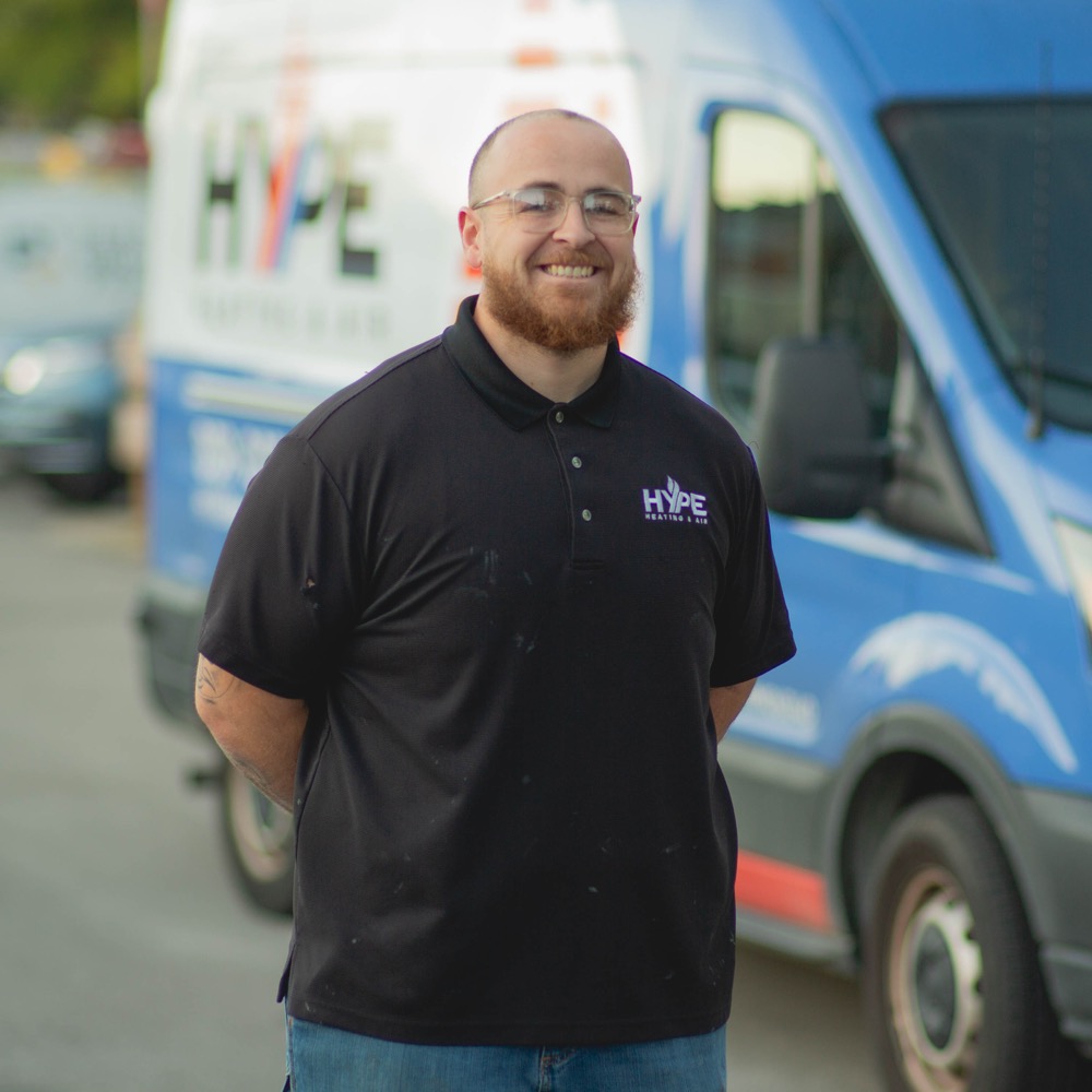 A HYPE team member beside a HYPE service van
