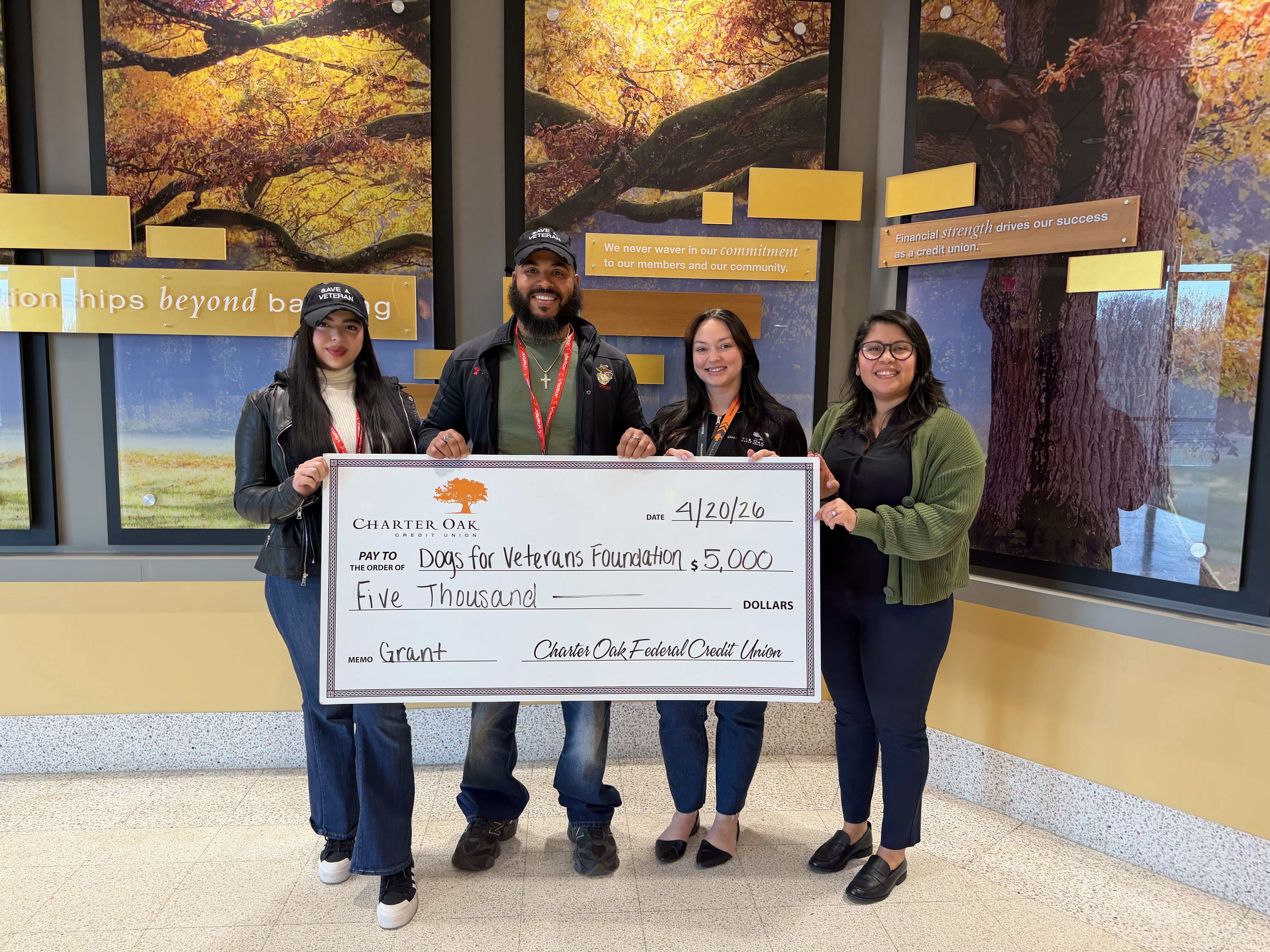 Charter Oak Credit Union presenting a $5,000 grant check to Dogs for Veterans Foundation