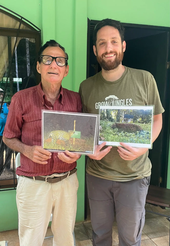 Alcides Parajeles with feline researcher, sharing discoveries from his 600-hectare conservation farm