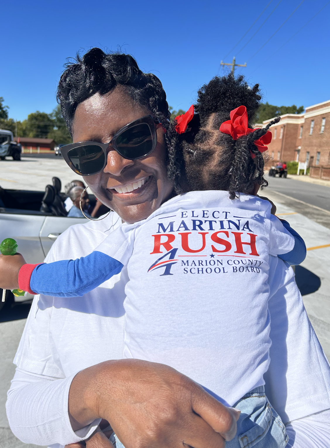 Martina Rush with a young supporter at the Golden Leaf Festival Parade
