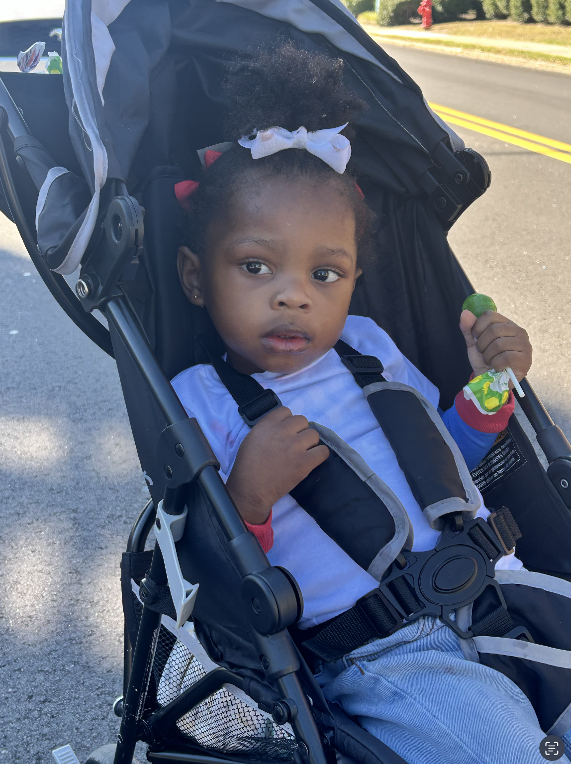 A young parade-goer enjoying the festivities