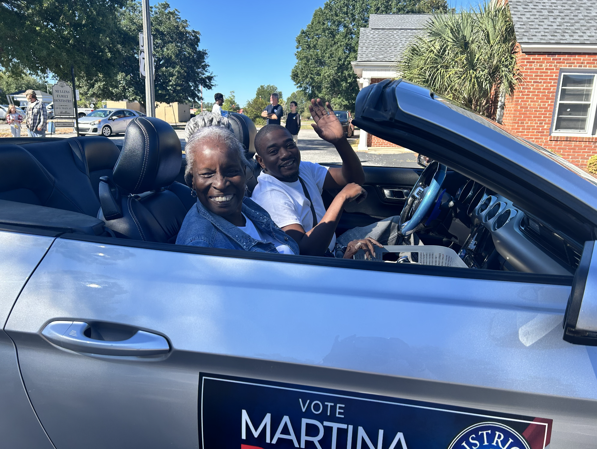 Parade supporters in the campaign convertible