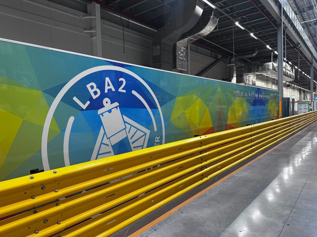 Completed wall wrap with yellow safety barriers