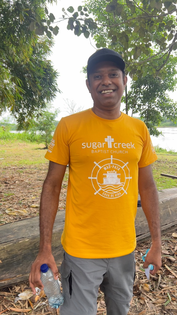 Across the Amazon — a mission volunteer wearing a Sugar Creek Baptist Church shirt