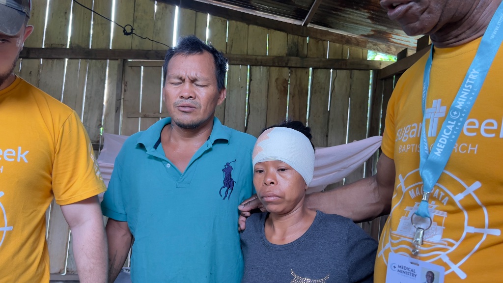 Across the Amazon — a quiet moment of prayer shared by the mission team