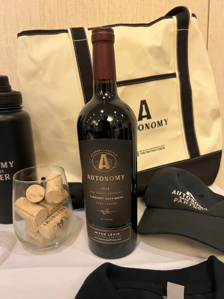 Autonomy goods — tote, cap and wine